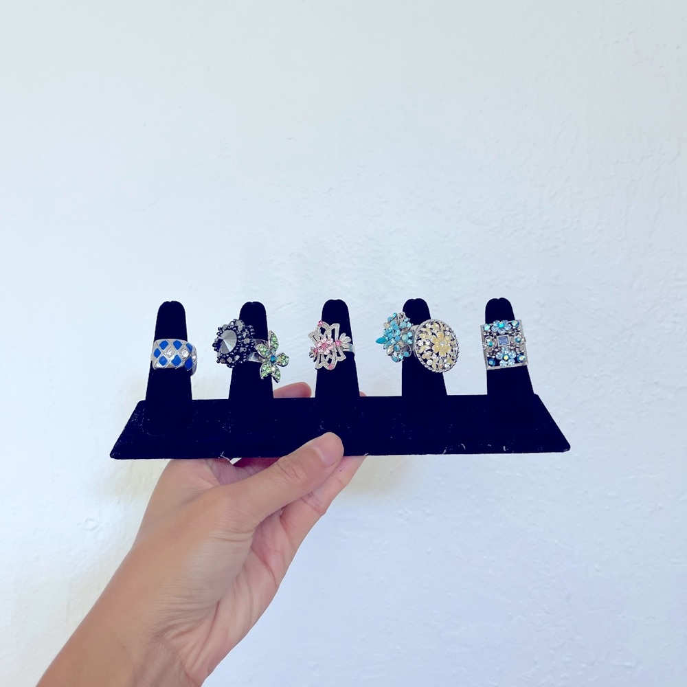Seven piece fashion costume adjustable rings bundle with holder